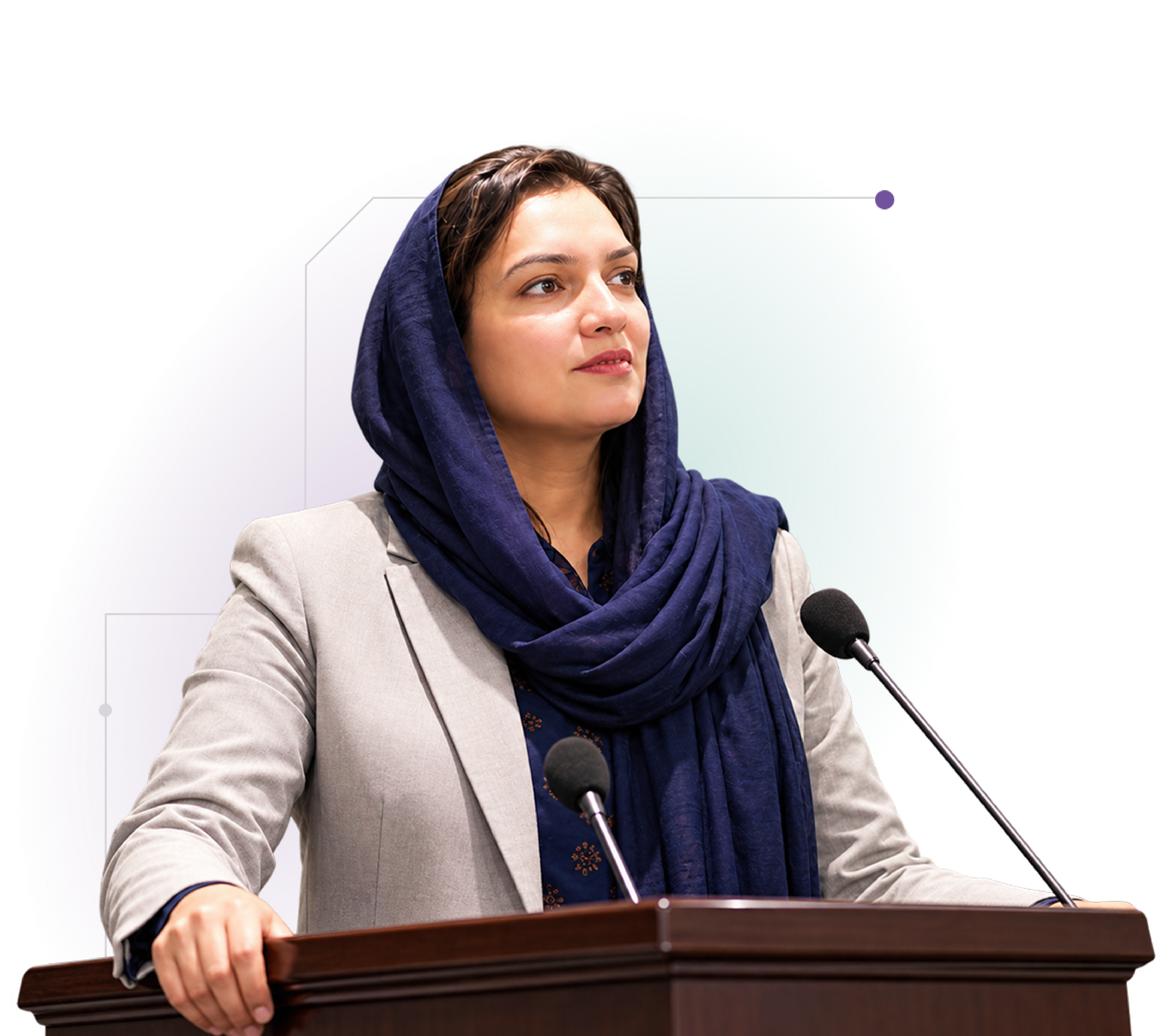Portrait of Dr. Kiran Khurshid speaking at a podium